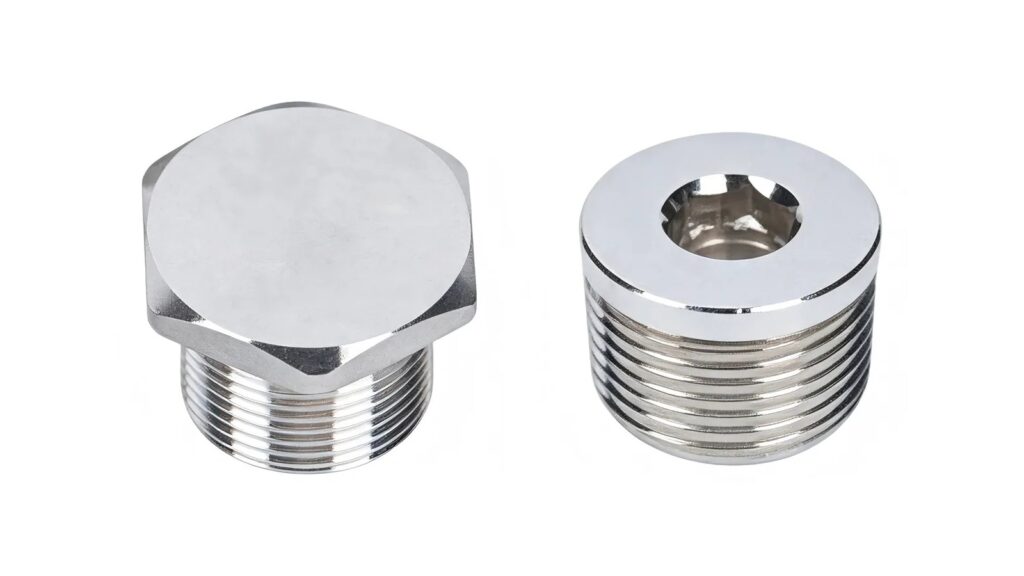 Class I Division 1 vs Zone 1: Why They Are Not Identical Two metal threaded plugs on a white background for Class I Division 1 and Zone 1 equipment selection