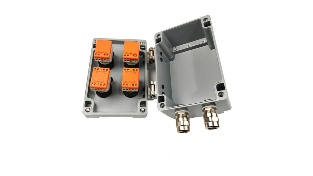 Explosion-Proof Trace Heating: 12 Buyer FAQs Open cast-metal control enclosure with four orange panel modules and two cable entries