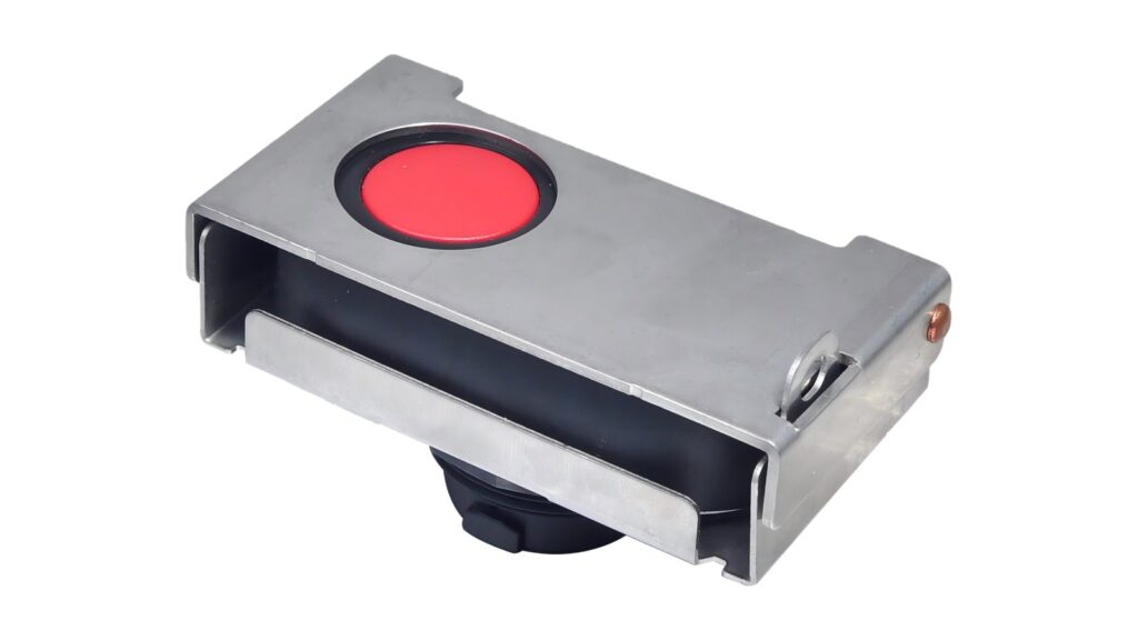 IEC 60079-17 Inspection Grades: Visual, Close, Detailed Red panel-mounted control device inside a stainless steel protective guard on a white background
