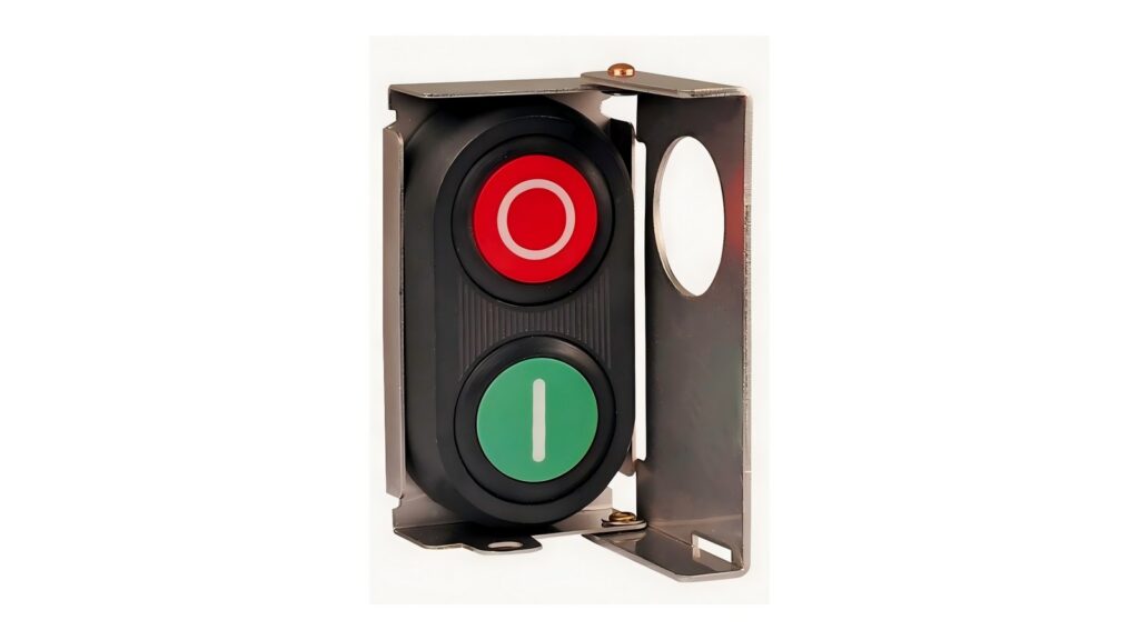 MMAIATEX Ex d and Conduit Guides: September Update Red and green industrial push-button assembly with metal guard photographed on a white background
